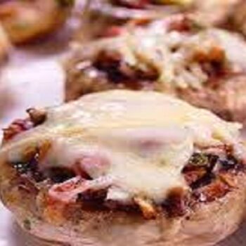 ¿Cómo hacer champiñones rellenos al horno con jamón y queso?